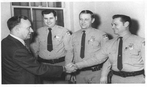 Officers Congratulate Chief Gass